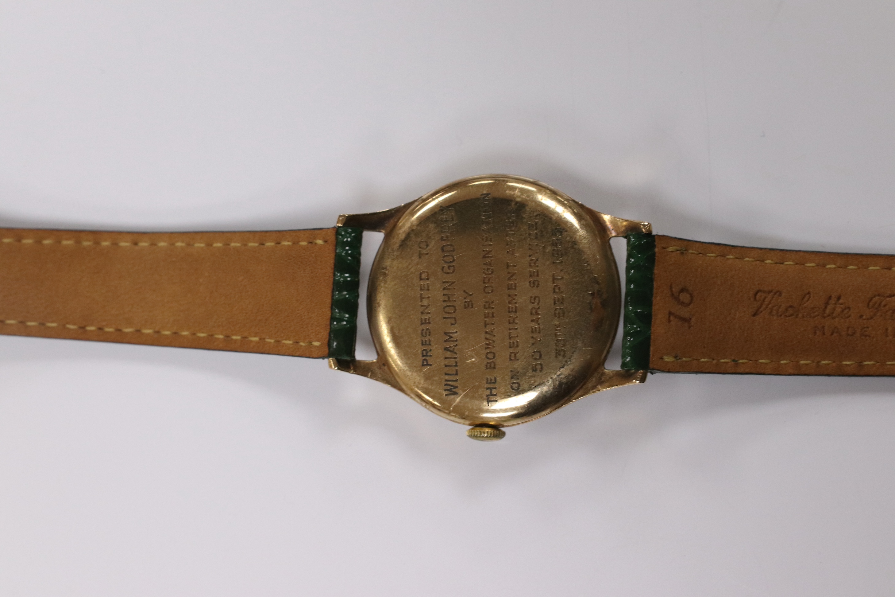 A gentleman's 1950's 9ct gold Movado manual wind wrist watch, with Arabic dial, subsidiary seconds and case back inscription, case diameter 31mm, on a later associated leather strap. Condition - fair